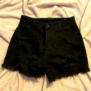 Distressed women’s black Jean shorts.  Runs big